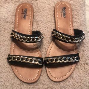 Women’s black and gold sandals